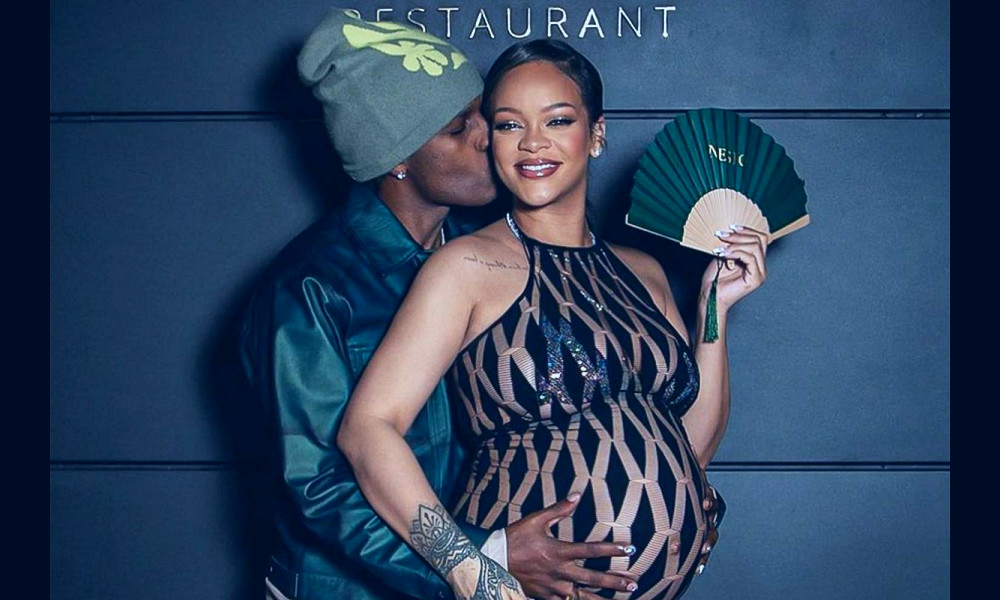 Pregnant Rihanna Gets a Kiss from A$AP Rocky as He Cradles Her Bump: Photo
